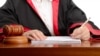 Generic -- Female judge writing the verdict (©Shutterstock)